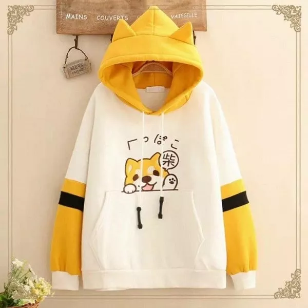 alt text: Áo hoodie màu hồng có tai mèo